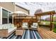 Relaxing back deck with comfortable outdoor seating and charming swing, perfect for enjoying the outdoors at 3393 Paisley Pointe, Whitestown, IN 46075