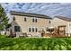 Exterior of home with a well-maintained backyard, hot tub, and wooden deck with pergola at 3393 Paisley Pointe, Whitestown, IN 46075