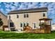Exterior of home with a well-maintained backyard, hot tub, and wooden deck at 3393 Paisley Pointe, Whitestown, IN 46075