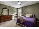 Relaxing bedroom with a rocking chair, dresser, and a cozy bed with plush pillows, offering a peaceful retreat at 3393 Paisley Pointe, Whitestown, IN 46075