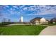 View of the community pool, silo, and pool house surrounded by green grass at 3393 Paisley Pointe, Whitestown, IN 46075