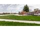 Elegant community entrance sign with stone accents, mature landscaping, and well-maintained greenery at 3393 Paisley Pointe, Whitestown, IN 46075