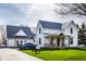 Charming two-story home with metal roof, covered front porch, and neatly manicured lawn in a suburban neighborhood at 3393 Paisley Pointe, Whitestown, IN 46075