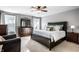 Well-lit main bedroom features a large bed, dresser, and matching nightstands at 3393 Paisley Pointe, Whitestown, IN 46075