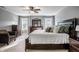 Spacious main bedroom suite with natural light, a ceiling fan, and dark wood furniture at 3393 Paisley Pointe, Whitestown, IN 46075