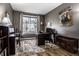 Inviting home office space with natural light, desk, chair, and wooden accents at 3393 Paisley Pointe, Whitestown, IN 46075