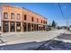 Exterior view of commercial storefronts with brick facade and street access at 3393 Paisley Pointe, Whitestown, IN 46075