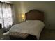 Bedroom with light colored walls, carpet, and a wooden bed frame at 3643 Reflections Ln # 5, Indianapolis, IN 46214