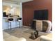 Open concept living room with bar stool seating, a glimpse of the kitchen, and comfortable seating arrangements at 3643 Reflections Ln # 5, Indianapolis, IN 46214