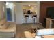 Open concept living room with bar stool seating, a glimpse of the kitchen, and comfortable seating arrangements at 3643 Reflections Ln # 5, Indianapolis, IN 46214
