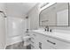 Modern bathroom boasts white vanity with black hardware, and a shower-tub combination at 4057 Knollwood Ave, Franklin, IN 46131