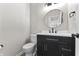Updated half bath with stylish vanity, updated fixtures, and new toilet at 4057 Knollwood Ave, Franklin, IN 46131