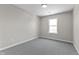 Bedroom features neutral paint, carpet, and natural light from the window at 4057 Knollwood Ave, Franklin, IN 46131