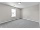 Bedroom with neutral walls, carpet, and natural light from the double-hung window at 4057 Knollwood Ave, Franklin, IN 46131
