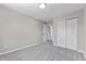 Bedroom features neutral paint, carpet, and views to doors of closets at 4057 Knollwood Ave, Franklin, IN 46131