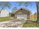 View of the front of a house with a two-car garage and front porch at 4057 Knollwood Ave, Franklin, IN 46131