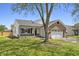 Well-maintained home with a lush front yard and a combination of brick and siding exterior at 4057 Knollwood Ave, Franklin, IN 46131