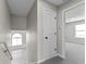 Upstairs hallway with a stairwell, doorway to a bedroom, and hardwood-style flooring at 4057 Knollwood Ave, Franklin, IN 46131