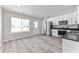 Eat-in kitchen with white cabinets, stainless steel appliances, and ample natural light at 4057 Knollwood Ave, Franklin, IN 46131