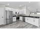 Modern kitchen with white cabinets, stainless steel appliances, and granite countertops at 4057 Knollwood Ave, Franklin, IN 46131