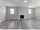 Cozy living room with a decorative fireplace and neutral wall paint at 4057 Knollwood Ave, Franklin, IN 46131