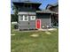 Backyard featuring a red door with lawn, landscaping, and room to entertain at 4205 Rookwood Ave, Indianapolis, IN 46208