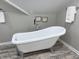 Bathroom featuring a freestanding tub, modern fixtures, and neutral decor at 4205 Rookwood Ave, Indianapolis, IN 46208