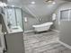 Bright bathroom featuring soaking tub, walk-in shower, and sleek modern fixtures at 4205 Rookwood Ave, Indianapolis, IN 46208