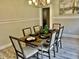 Charming dining room with a rustic wooden table and modern chandelier at 4205 Rookwood Ave, Indianapolis, IN 46208