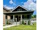 Charming single-story home with a well-manicured lawn and inviting front porch at 4205 Rookwood Ave, Indianapolis, IN 46208
