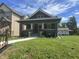 Charming single-story home with a well-manicured lawn and inviting front porch at 4205 Rookwood Ave, Indianapolis, IN 46208