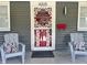 Inviting front porch with seating and a decorative door at 4205 Rookwood Ave, Indianapolis, IN 46208