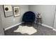 Cozy sitting area with chair, accent table, and plush rug at 4205 Rookwood Ave, Indianapolis, IN 46208