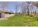 The expansive backyard provides ample space for outdoor activities and enjoying the natural surroundings at 4389 S Brooklawn Dr, New Palestine, IN 46163