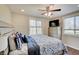 Cozy bedroom featuring a ceiling fan, dresser and large windows providing natural light at 4389 S Brooklawn Dr, New Palestine, IN 46163