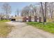 Charming brick home with a spacious yard and long gravel driveway at 4389 S Brooklawn Dr, New Palestine, IN 46163