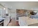 Kitchen featuring an island, stainless steel appliances, and wood accent wall at 4389 S Brooklawn Dr, New Palestine, IN 46163