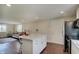 Kitchen featuring an island, stainless steel appliances, and hardwood floors at 4389 S Brooklawn Dr, New Palestine, IN 46163