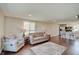 Inviting open-concept living room with a view of the modern kitchen at 4389 S Brooklawn Dr, New Palestine, IN 46163