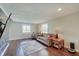 Living room showcasing neutral paint, hardwood floors, and plenty of natural light at 4389 S Brooklawn Dr, New Palestine, IN 46163