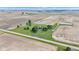 Aerial shot of a home with large lawn and outbuilding in the center of farmland under a blue sky at 4545 W 200 S, Lebanon, IN 46052