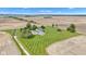 Beautiful aerial view of a well-maintained home with an in-ground pool, set on a large, green lawn at 4545 W 200 S, Lebanon, IN 46052