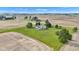 Aerial view featuring a home with a pool in the backyard, surrounded by green lawns and fields at 4545 W 200 S, Lebanon, IN 46052
