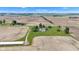 An aerial view reveals a home with a pool and outbuilding on a large manicured lawn in a rural setting at 4545 W 200 S, Lebanon, IN 46052
