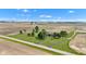 Aerial view highlights a charming home with outbuilding on a large, well-maintained lawn surrounded by farmland at 4545 W 200 S, Lebanon, IN 46052