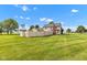 Spacious backyard featuring a well-maintained lawn, privacy fence, and mature trees at 4545 W 200 S, Lebanon, IN 46052