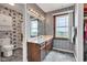 This well lit bathroom features ample counterspace, lots of storage and natural light at 4545 W 200 S, Lebanon, IN 46052