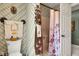 Cozy bathroom with patterned wallpaper, decorative towels, and shower with floral curtain at 4545 W 200 S, Lebanon, IN 46052