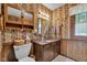Vintage bathroom with patterned wallpaper, granite counter tops and built in vanity, complete with ample storage at 4545 W 200 S, Lebanon, IN 46052