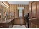 Charming bathroom with patterned wallpaper, granite counter tops and built in vanity, complete with modern washer and dryer at 4545 W 200 S, Lebanon, IN 46052